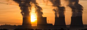 power station cooling towers at sunset